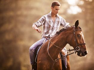 Man struggling to control horse