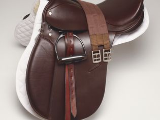 Brown Leather Horse Riding Saddle, Side View.