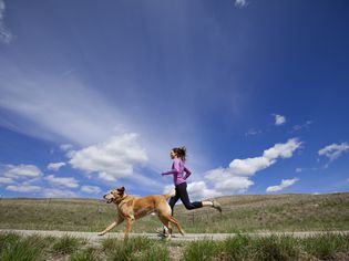 woman running with her dog