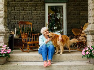 portrait of senior woman and golden retriever dog