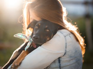 Woman Hugging Rescue Dog